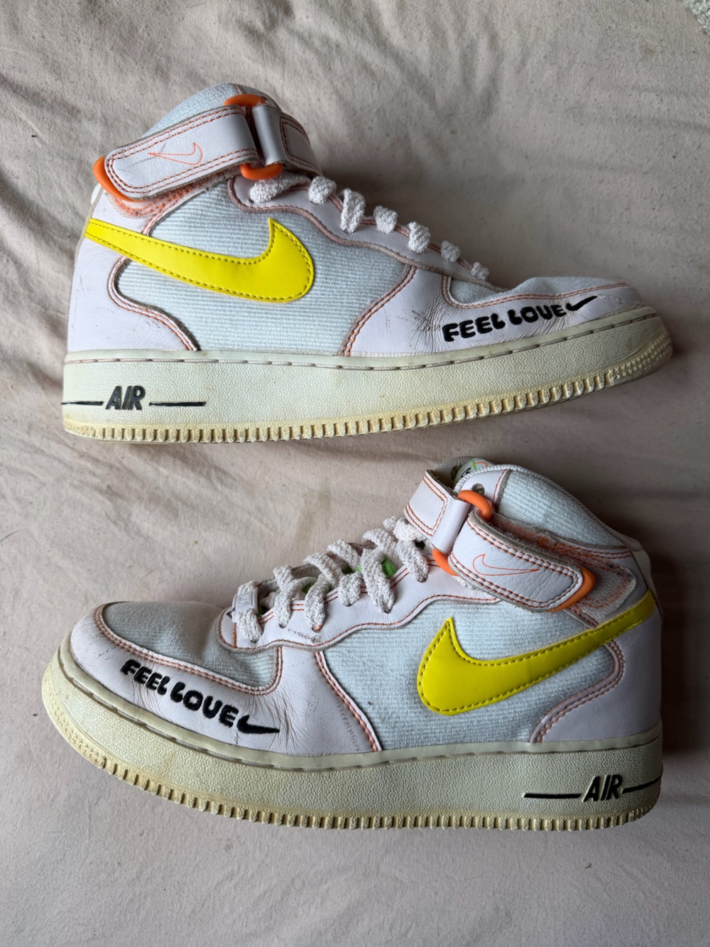 Nike Woman’s White High-Top Sneakers with Yellow Swoosh